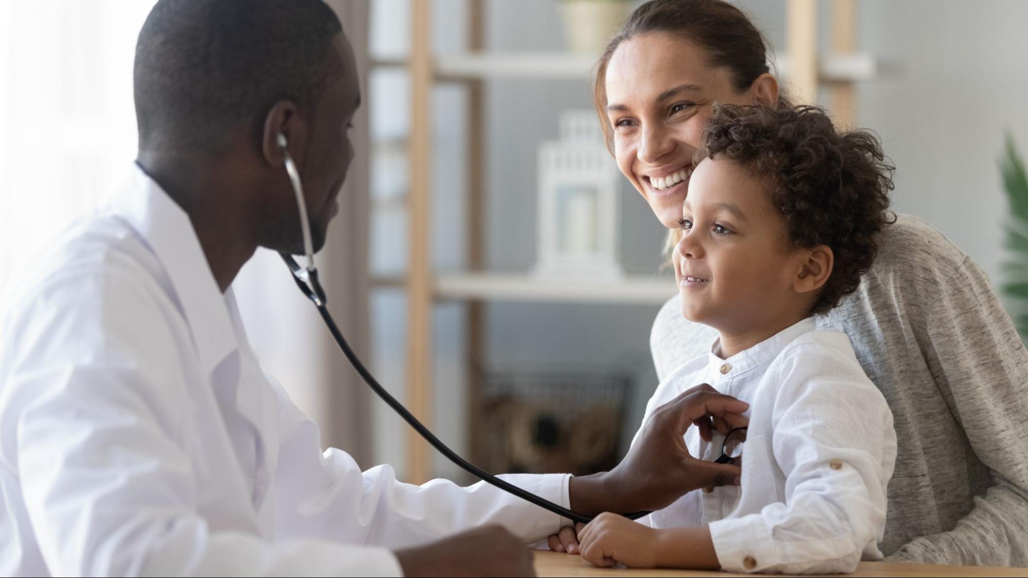 doctor examining child with stethoscope